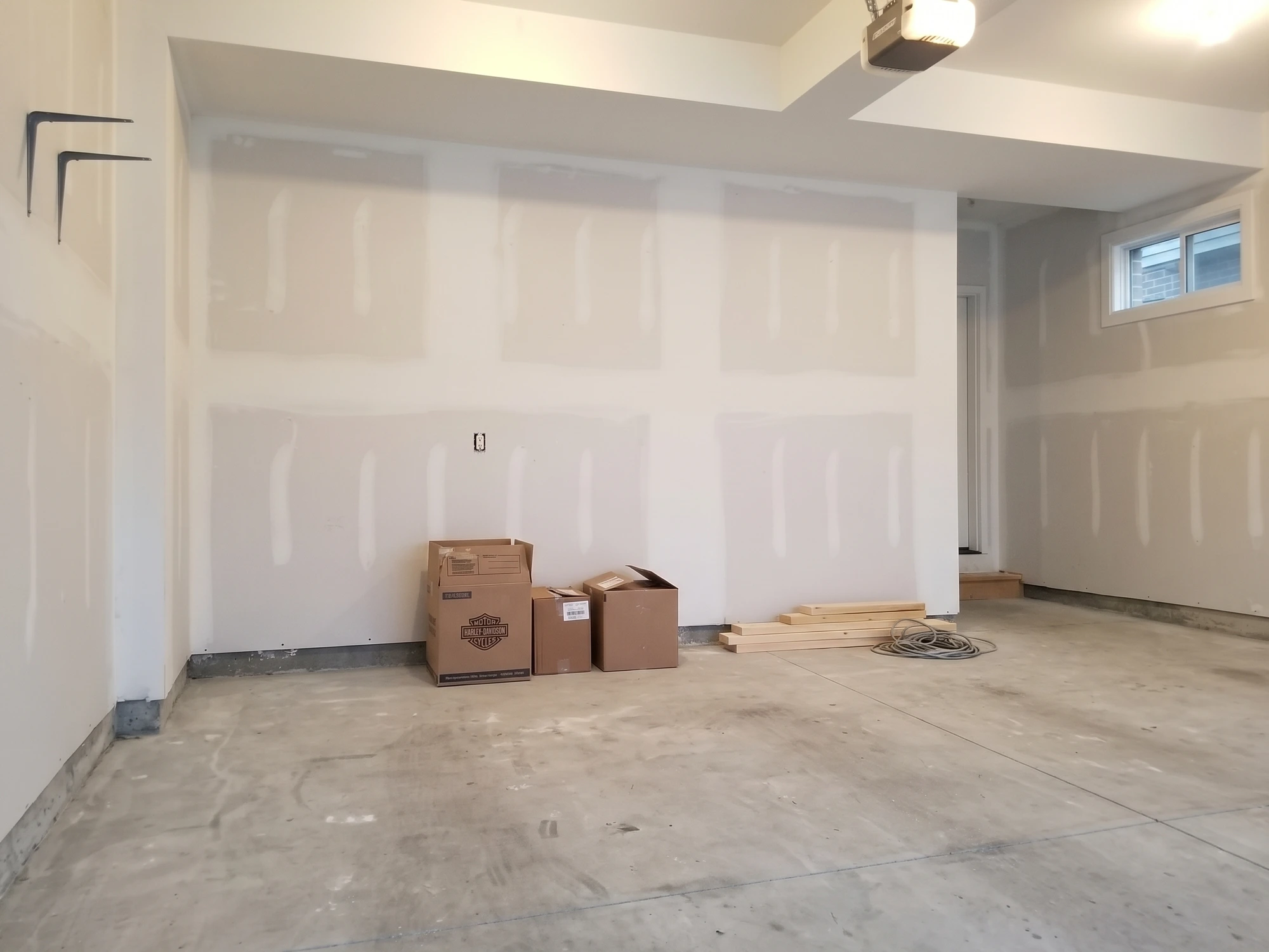 garage with white cabinets before